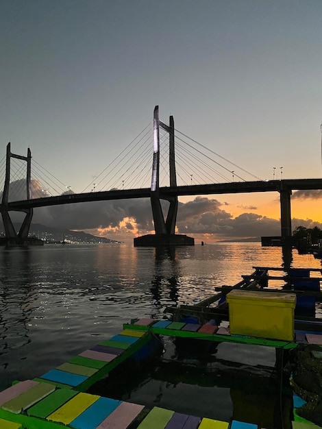 Photo merah putih bridge in sunset ambon