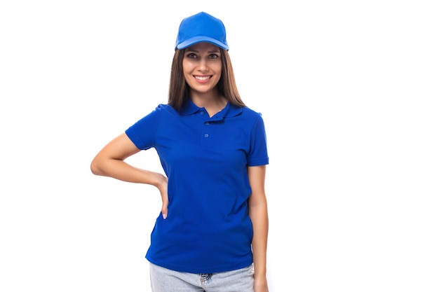 Merch design concept young woman in a blue tshirt and cap on a white background with copy space