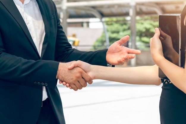 Merger and acquisition.Manager Caucasian businessman handshake with woman partnership.