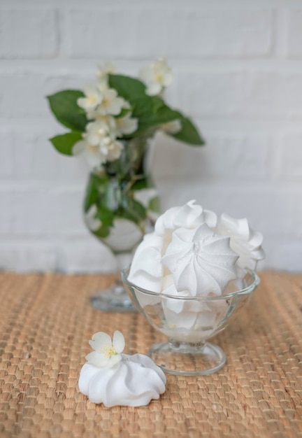 Meringue cake with a jasmine flowers