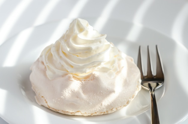 Meringue cake with whipped cream