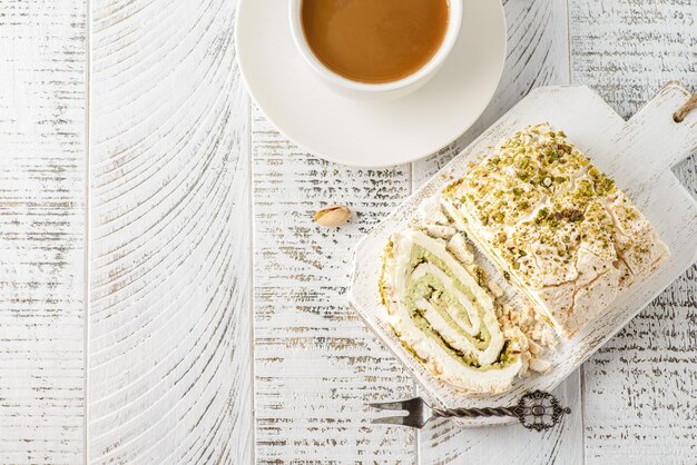 meringue roll cake with pistachio