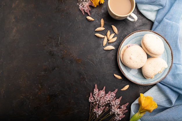 Meringues cakes with cup of coffee