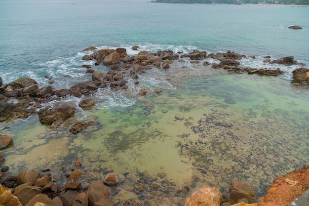 Merissa, Sri Lanka. Huge boulders on the beach.