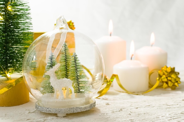 Merry Christmas 2023 Christmas gifts candles surprises on white wooden table