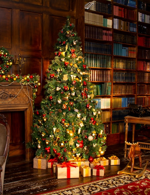 Merry Christmas Christmas tree with beautiful balls in brown interior room in classic style Chris