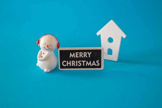 Merry christmas concept merry christmas text composed on wooden board