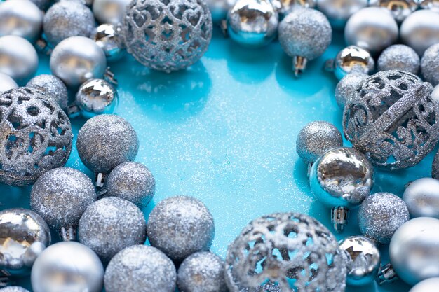 Merry Christmas and Happy Holidays, christmas baubles decoration on blue background.