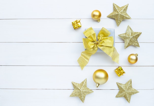 Merry Christmas and Happy Holidays, Christmas composition. gift box and decorations on white wooden background. 