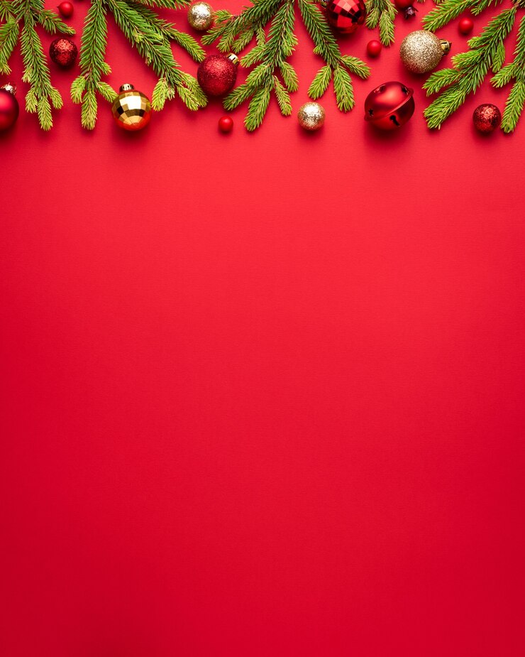 Merry Christmas and Happy New Year red background with holiday decoration. Copy space for message. Top view, flat lay