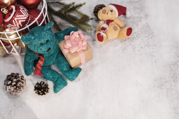 Merry Christmas and Happy New Year. Winter season holiday decoration with teddy bear and gift at home.