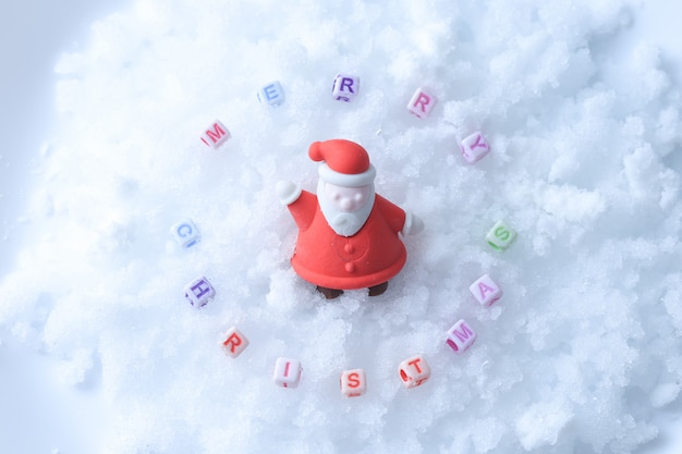 Merry Christmas message made with letter cubes over snow