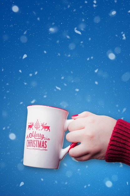 Merry Christmas mug with blue snowy background