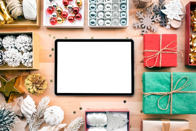 Merry christmas with blank screen of modern tablet