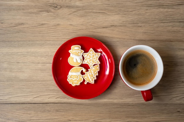 Merry Christmas with homemade cookies and coffee cup on wood table background Xmas eve party holiday and happy New Year concept