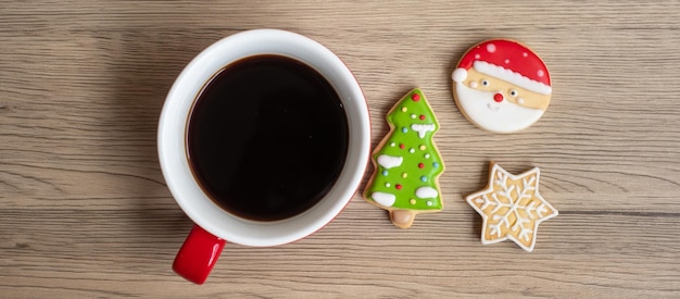 Merry Christmas with homemade cookies and coffee cup on wood table background Xmas eve party holiday and happy New Year concept