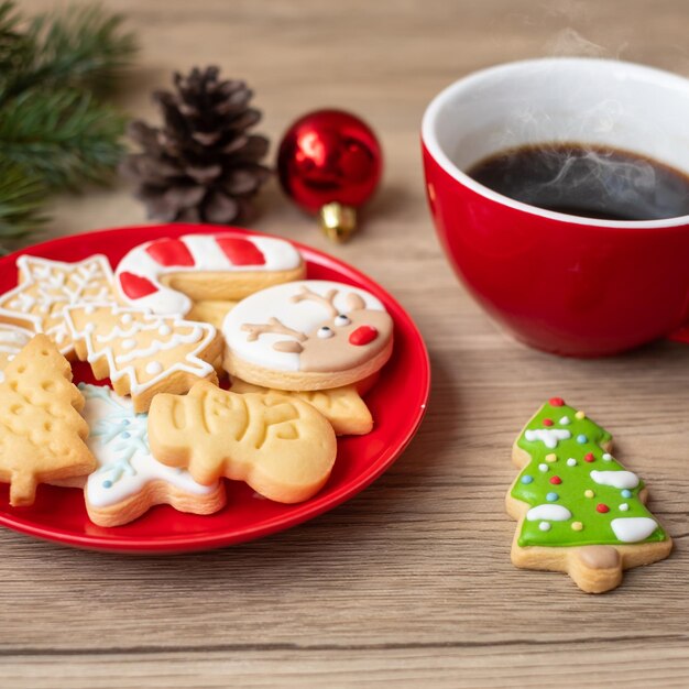 Merry Christmas with homemade cookies and coffee cup on wood table background Xmas eve party holiday and happy New Year concept