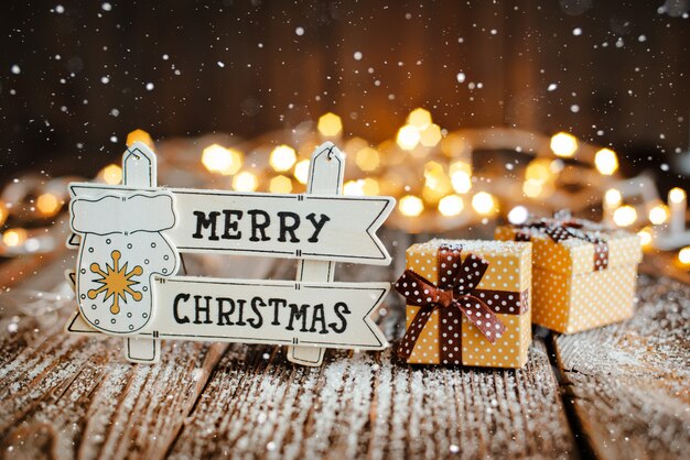 merry christmas on wood sign with decoration