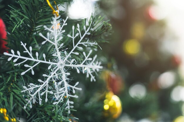 Merry x-mas,Close up of Colorful balls ,gifts box and Christmas greeting picture parcel decoration on Green Christmas tree background Decoration During Christmas and New Year.