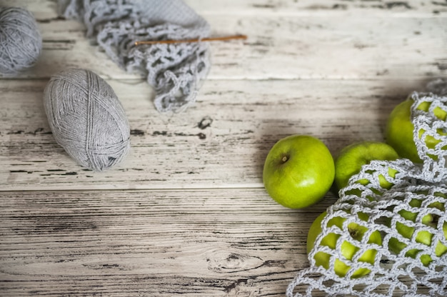 Mesh bag full of colorful apples from the garden.