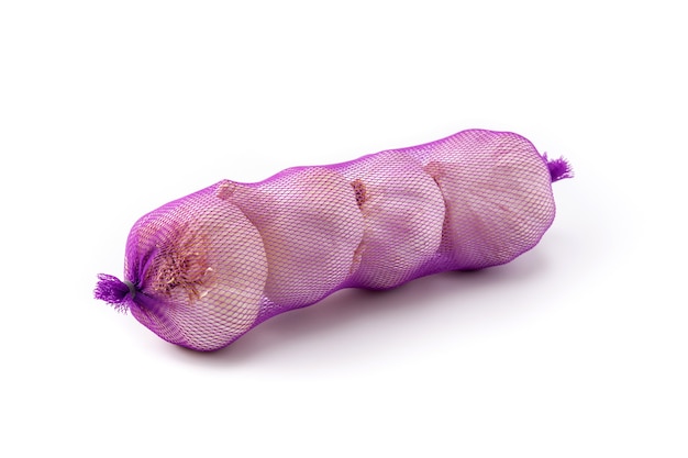 Mesh bag of garlic cloves isolated