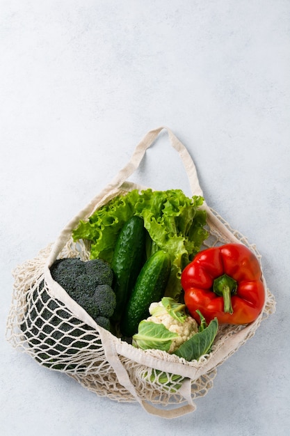 Mesh bag with vegetables. Zero waste and health vegan and vegetarian food concept. 