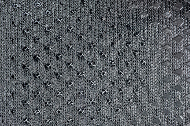 Mesh fabric of sports shoes in gray color shoes made of mesh
fabric with a textile texture for an active lifestyle running and
sports modern running shoes closeup