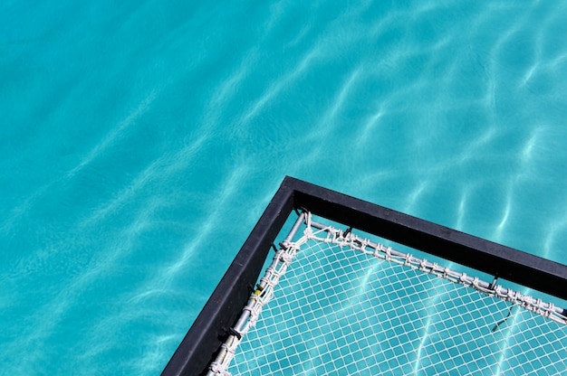 Mesh seat jut out on swimming pool