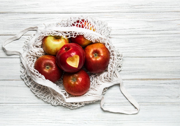 Mesh shopping bag with apples