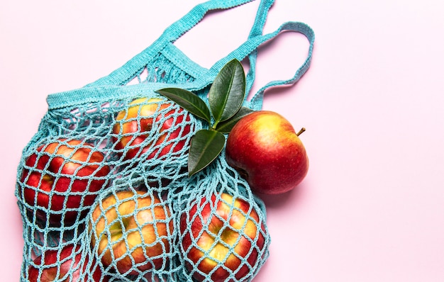 Mesh shopping bag with apples