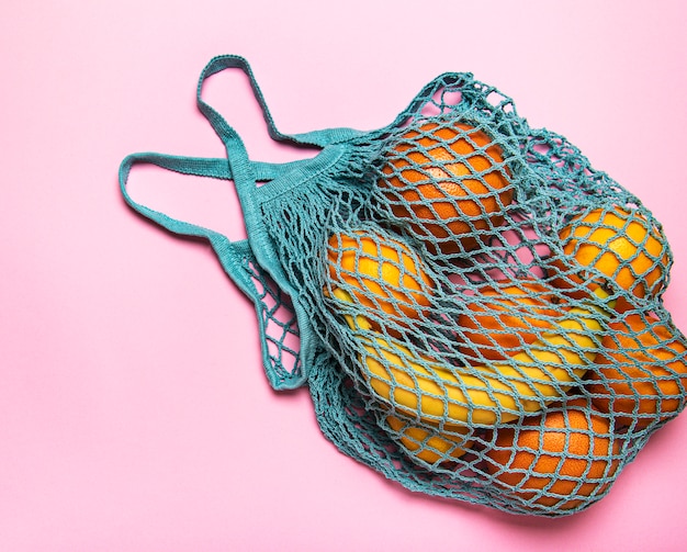 Mesh shopping bag with fruits