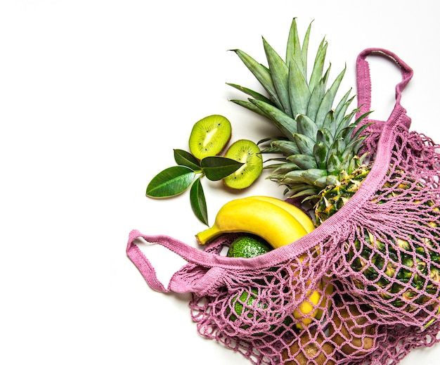 Mesh shopping bag with fruits