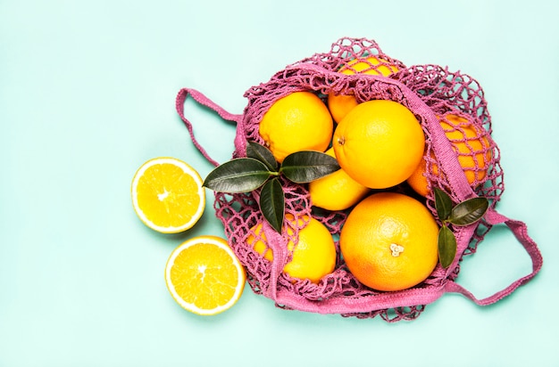 Mesh shopping bag with oranges