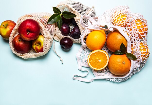 Mesh shopping bags with fruits