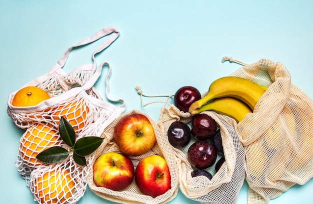 Mesh shopping bags with fruits