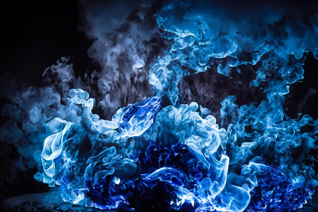 Photo the mesmerizing blue flames danced gracefully against the pitchblack backdrop