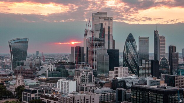 Mesmerizing cityscape view with high and modern skyscrapers at scenic sunset in London