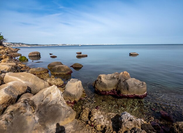 Mesmerizing shot of a rocky seashore under a cloudy sky in ostsee germany