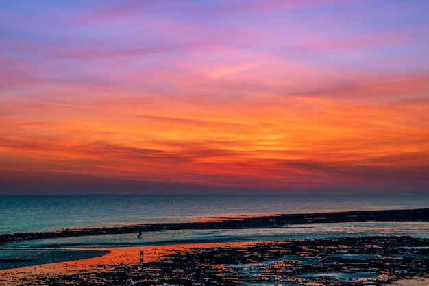 Mesmerizing sunset sky over the sea and beach