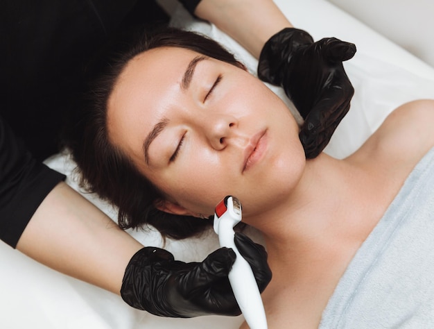 Mesotherapy using microneedles facial rejuvenation and\
moisturizing procedure the process of mesotherapy procedure in the\
spa clinic mesotherapy of the face