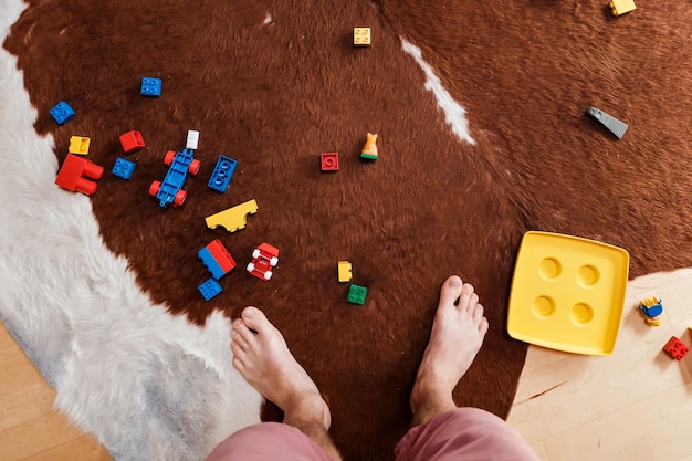 Mess from construction of toy building blocks in the floor