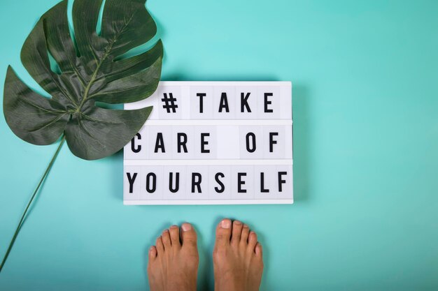 Message in a light box for selfcare mental health emotional wellbeing Top view