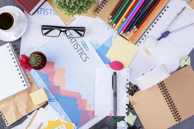 Messy desk with business report