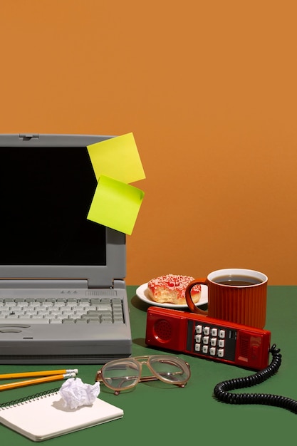 messy office desk with old computer still life