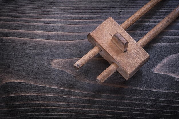 Messy surface gage on wooden board construction concept