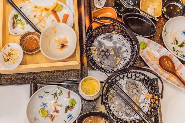 Messy table after meal in Japanese restaurant Dirty finish meal leftovers concepts