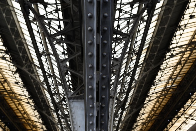 Metal arched frame construction of the old railway station in Europe