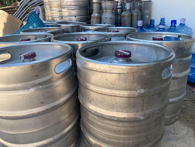 Metal barrels at a construction site large containers for liquid and bulk building materials