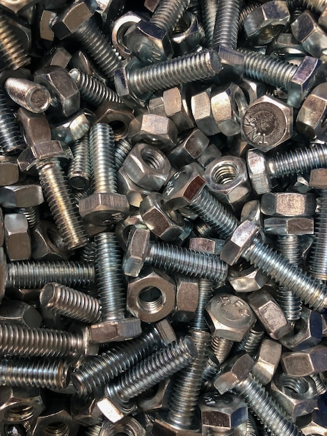 Photo metal bolts and nuts piled