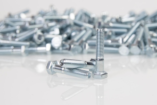 Metal bolts on a white background engineering fasteners